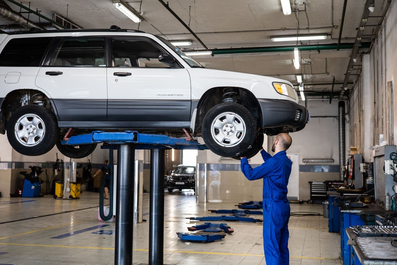 Mechanic inspecting a vehicle