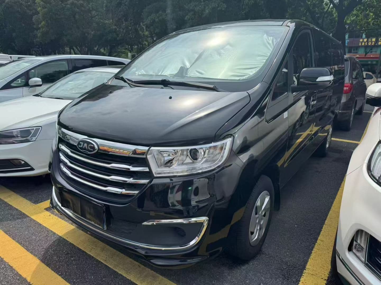 Black JAC passenger van